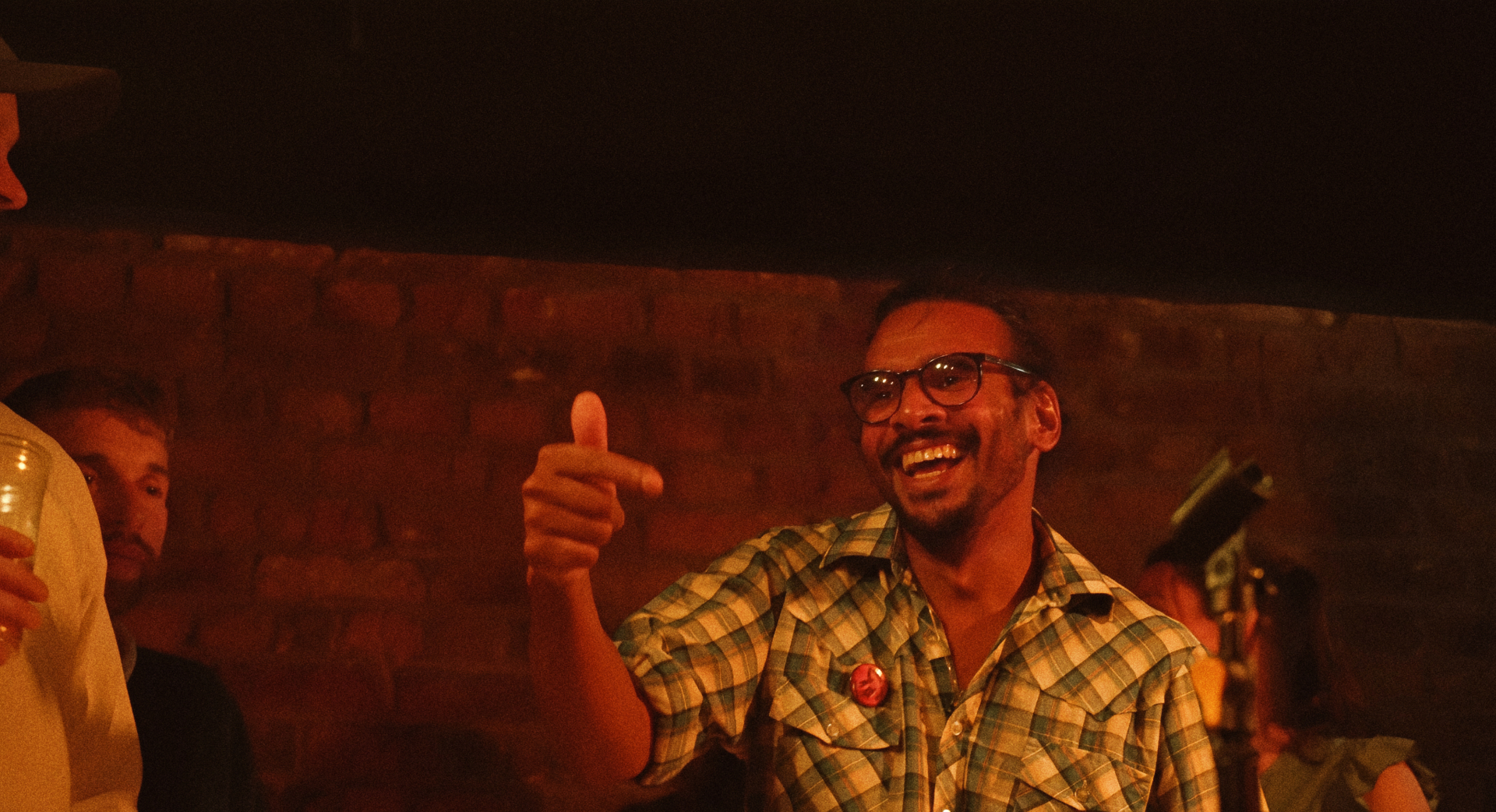 Neil Nayar, band manager and protagonist in The Banjo Boys, laughing and pointing at The Madalitso Experience at the Troubadour, London