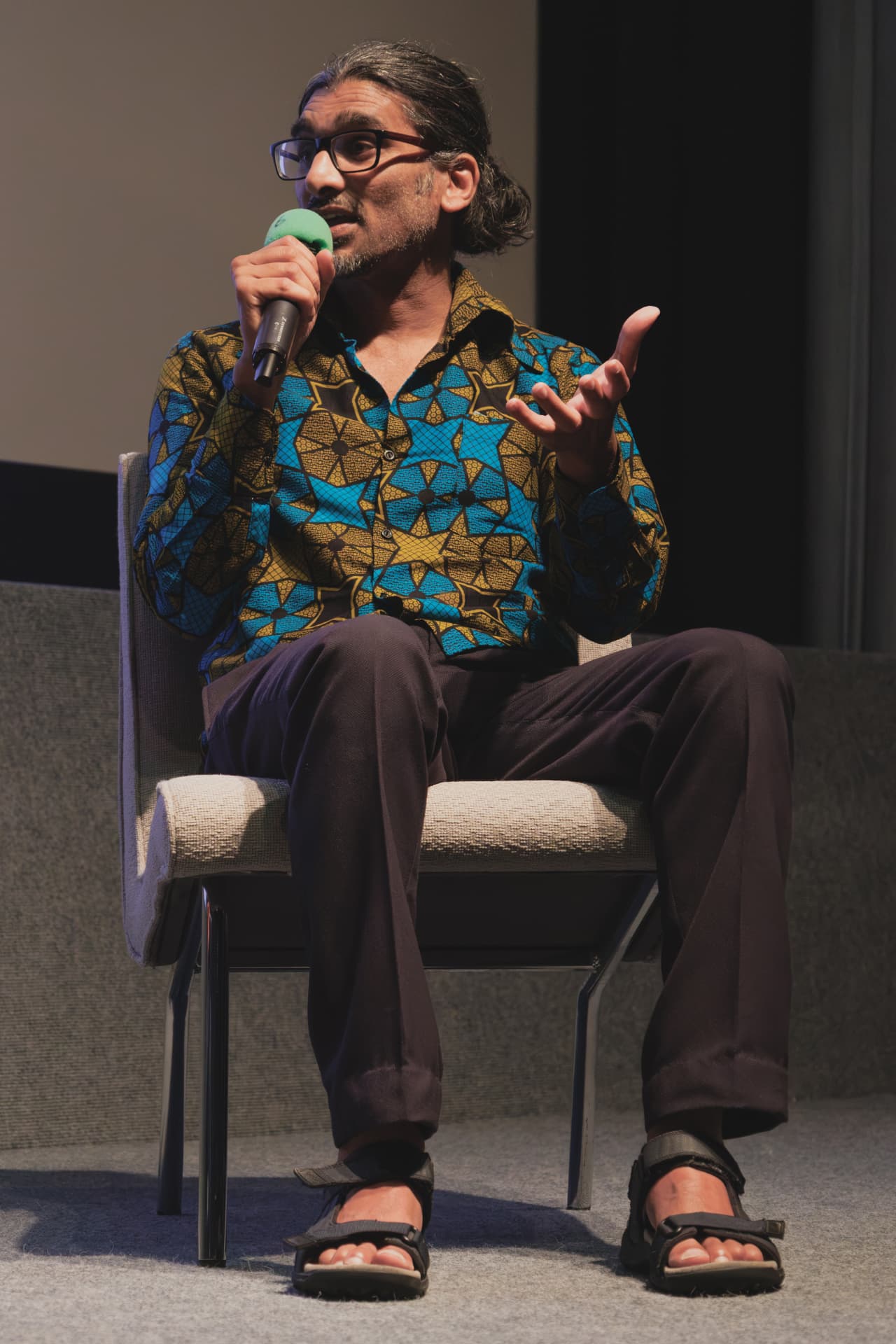 Johan Nayar answering questions on stage during the Watch Africa Q&A, Chapter Arts Centre, Cardiff