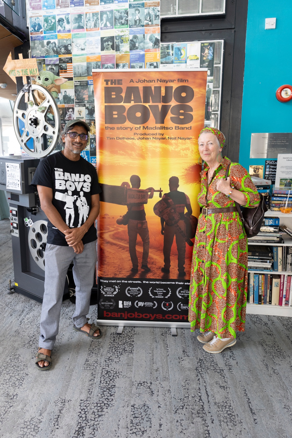 Director Johan Nayar with Madeleine Casey beside The Banjo Boys poster at Harbour Lights, Southampton