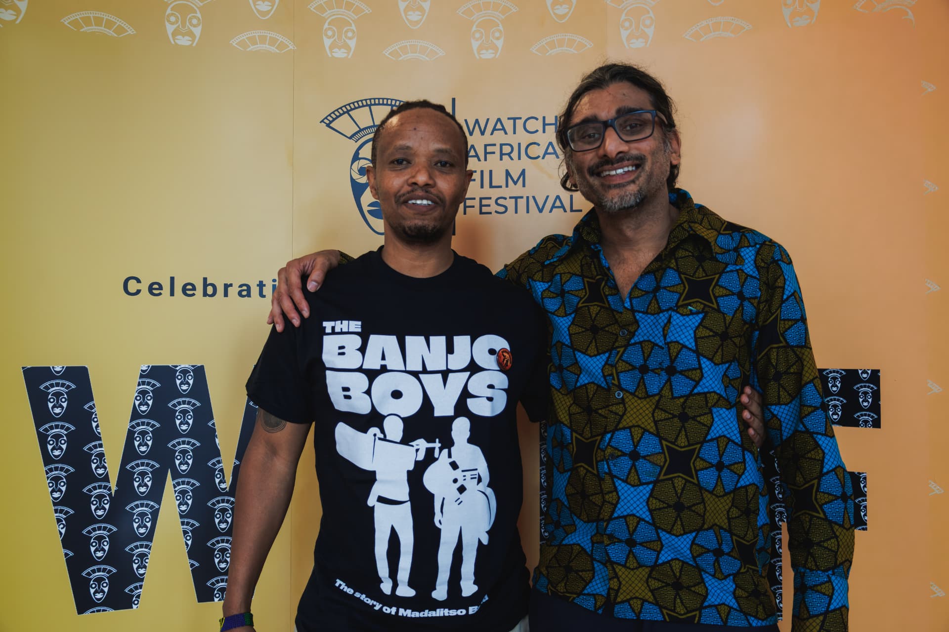Fadhili Maghiya and Johan Nayar in front of the Watch Africa Film Festival backdrop, Chapter Arts Centre, Cardiff