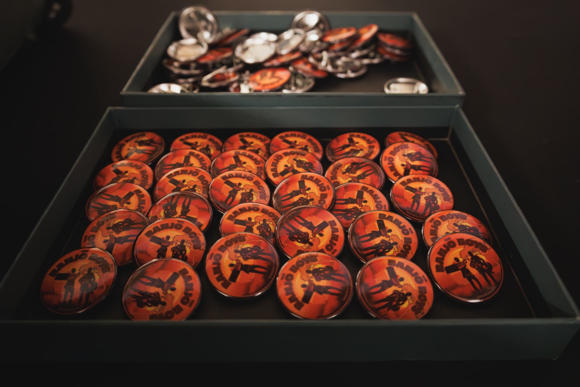 Trays of Banjo Boys badges ready for the audience at Watch Africa, Chapter Arts Centre, Cardiff