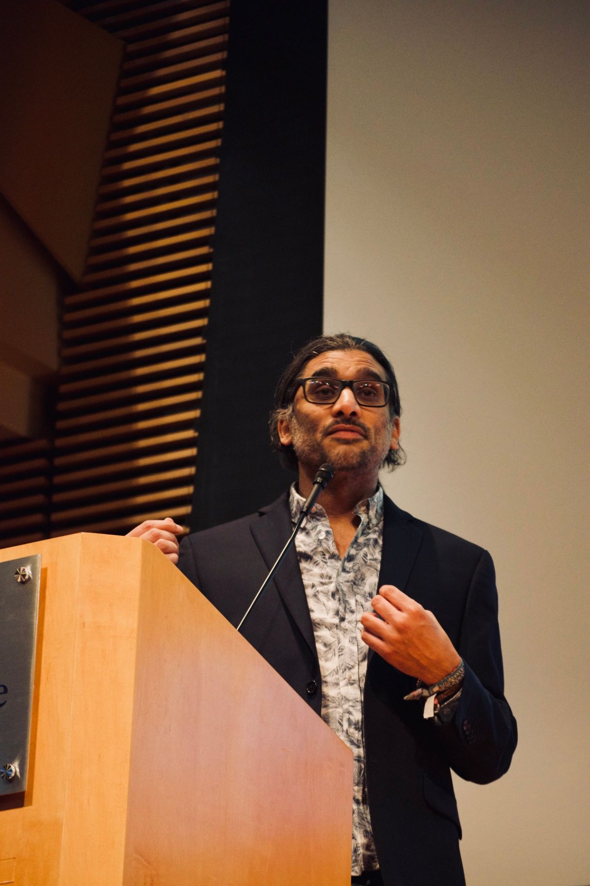 Director Johan Nayar addressing the audience from the podium at ADIFF, Columbia University