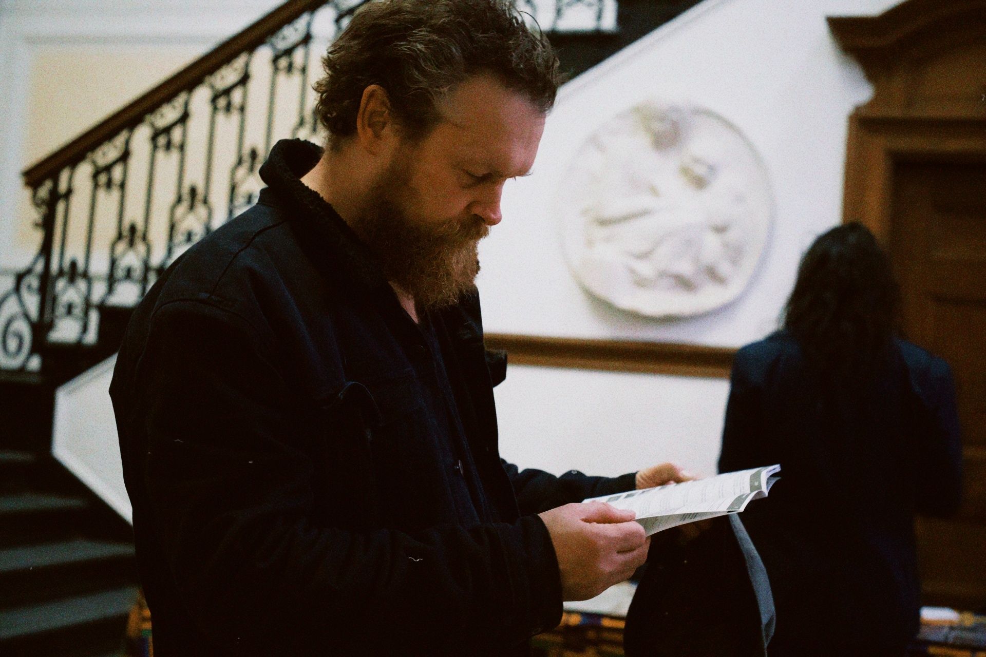 Singer Warren Malone reading the programme at the ADIFF international premiere, Columbia University, New York