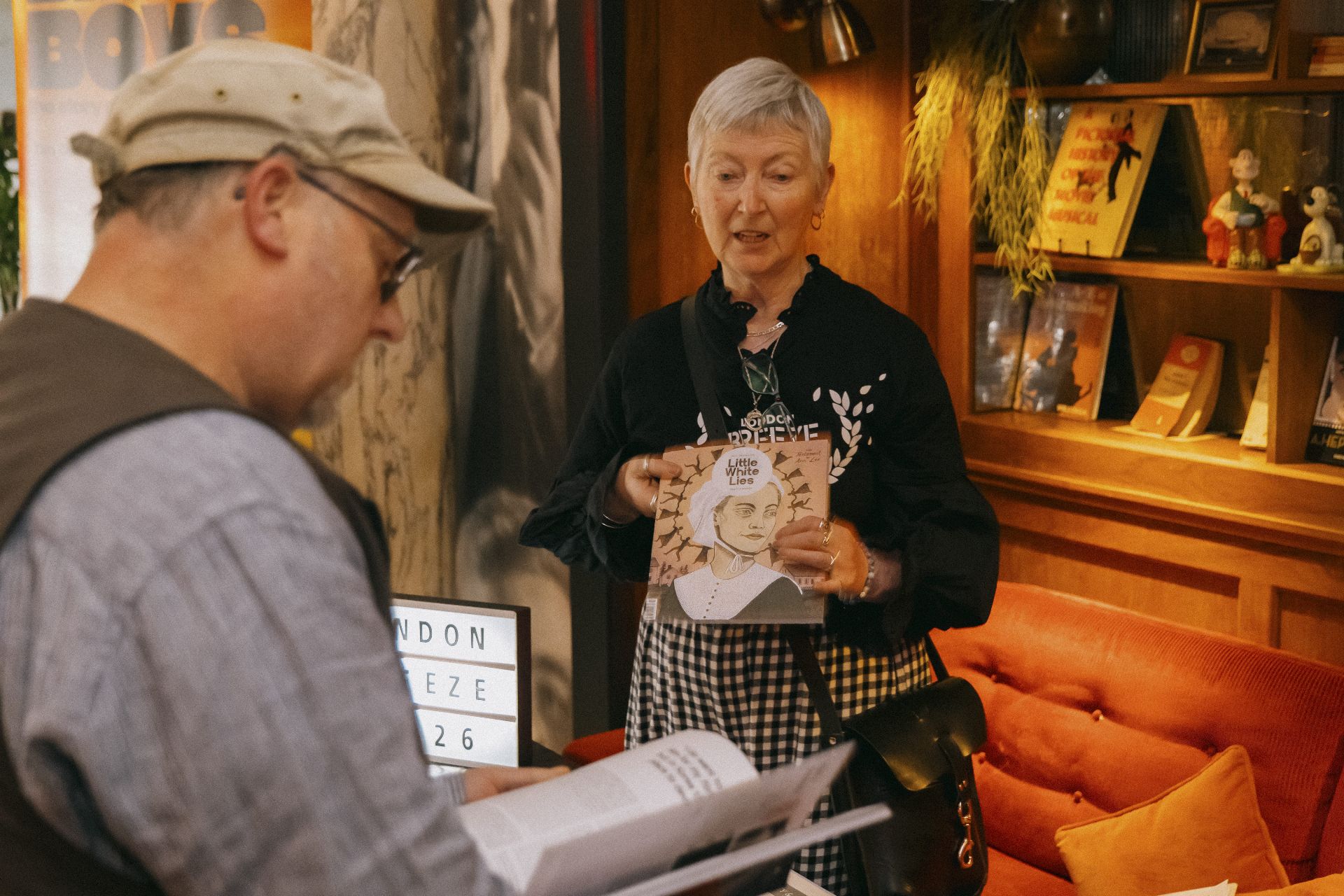 Guest holding a Little White Lies magazine in the Everyman Bristol lobby