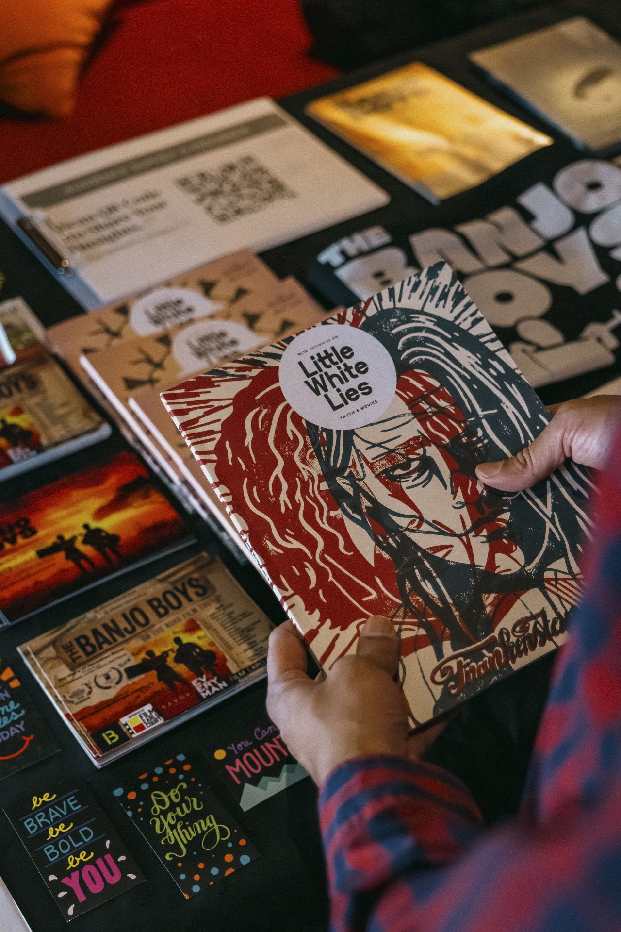 Close-up of The Banjo Boys CDs and London Breeze festival merchandise table in Bristol