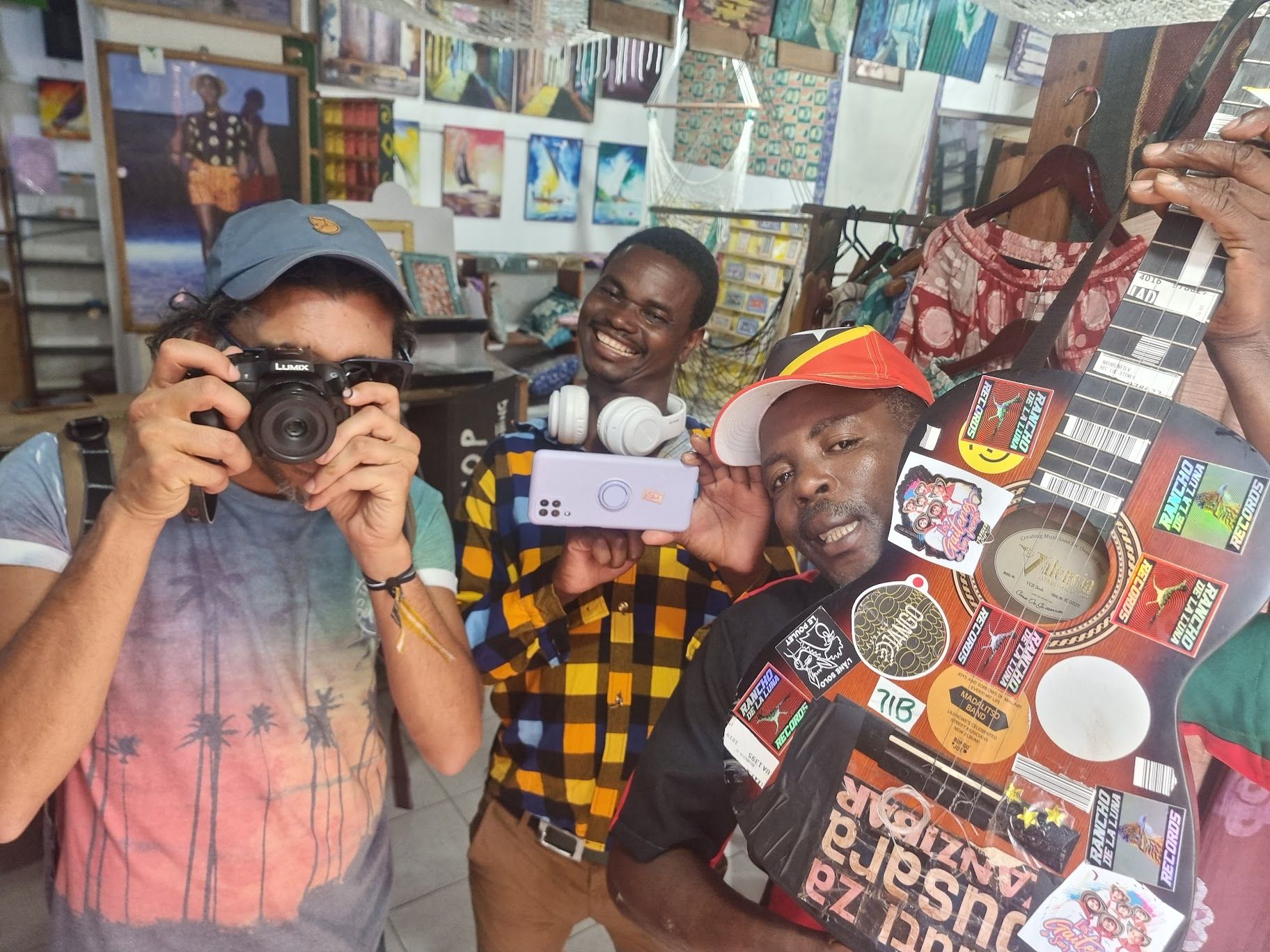 Johan Nayar with Yobu Maligwa and Yosefe Kalekeni — and their weapons of choice — in Zanzibar, 2023