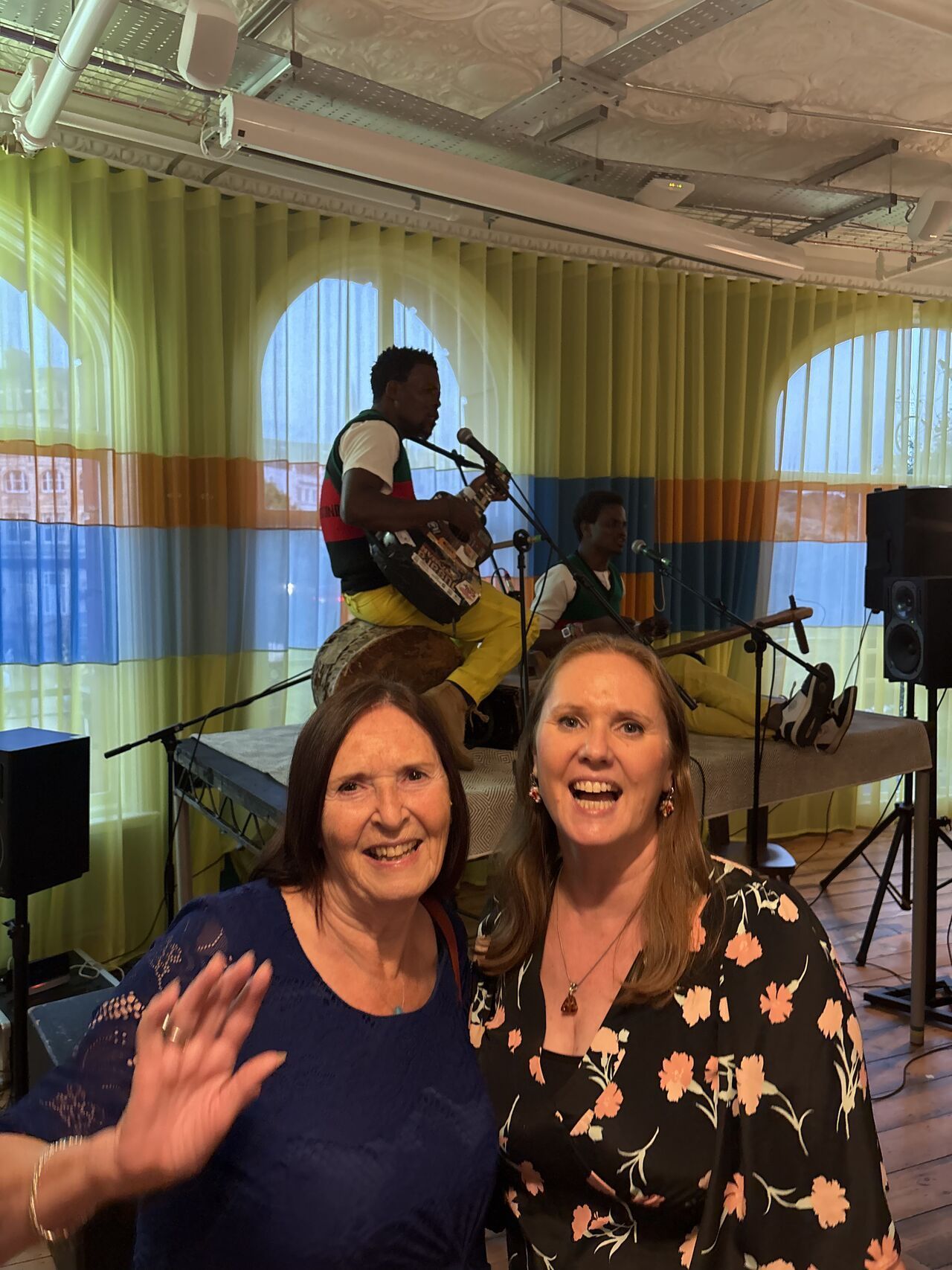 Claire Main at the Patch sizzle screening with the Madalitso Band performing on stage — 14 Aug 2025