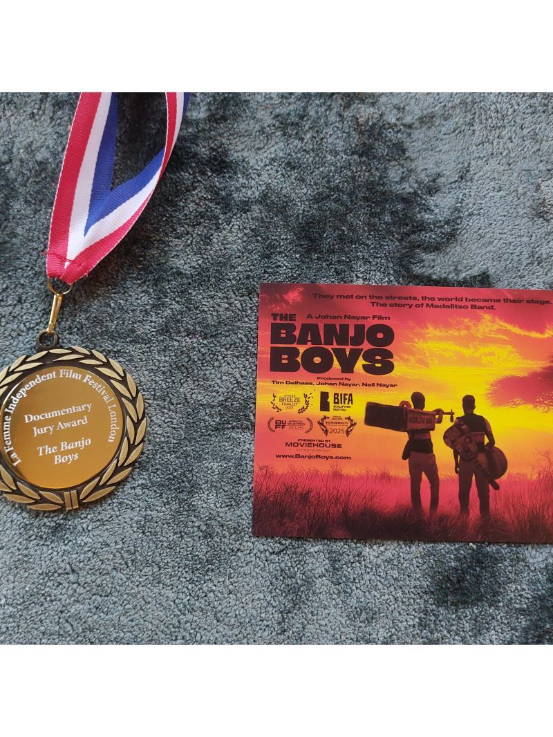 La Femme Independent Film Festival London Documentary Jury Award medal alongside The Banjo Boys film card