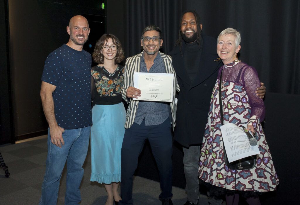 Johan Nayar with the team — including Sam Cullis, Emily Bolton and Madeleine Casey — after winning the Audience Award at London Breeze Film Festival Awards Night — 26 Oct 2025