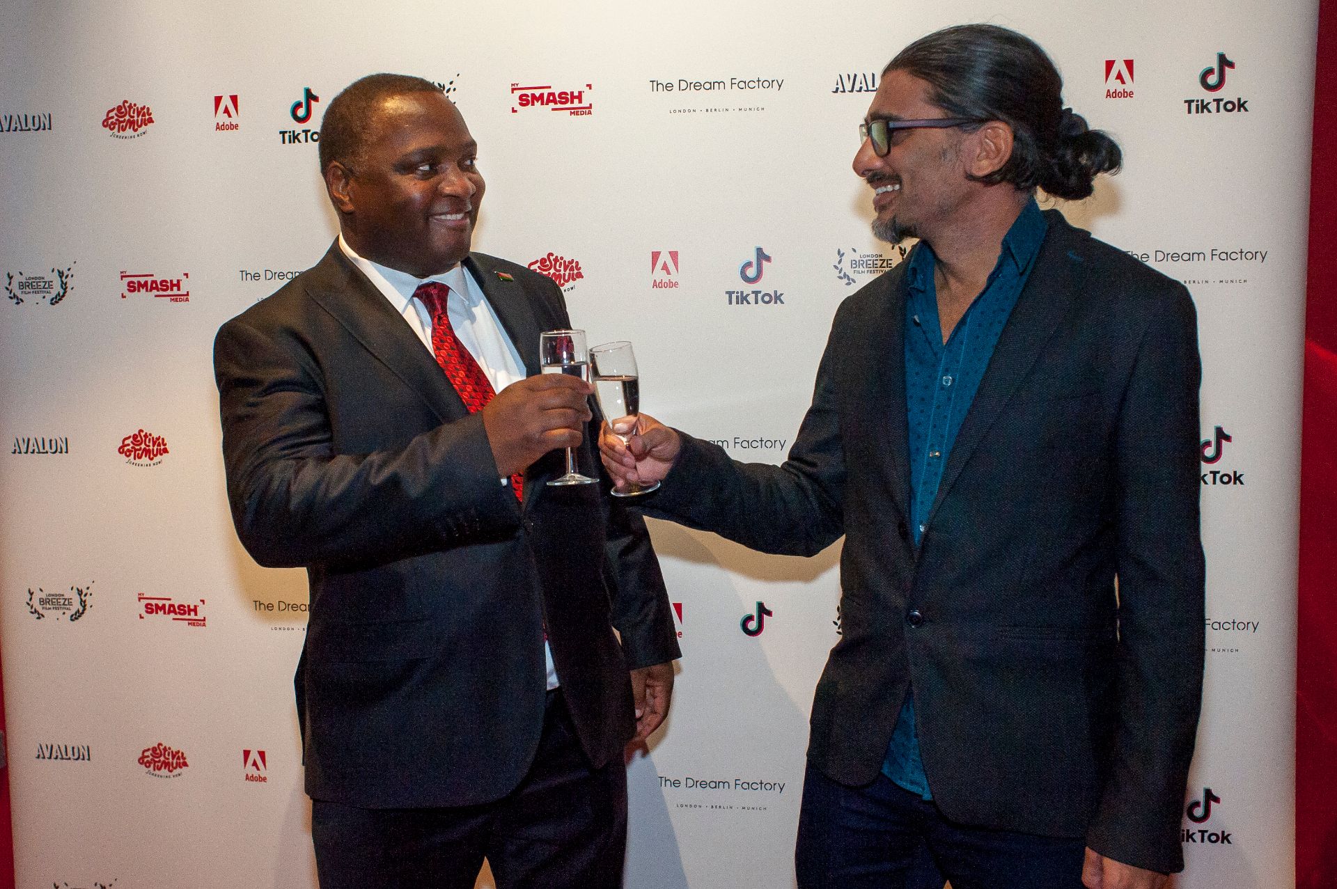 Director Johan Nayar with Malawi High Commissioner Thomas John Bisika at the London Breeze world premiere — 22 Oct 2025